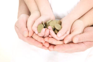 Hands holding coins